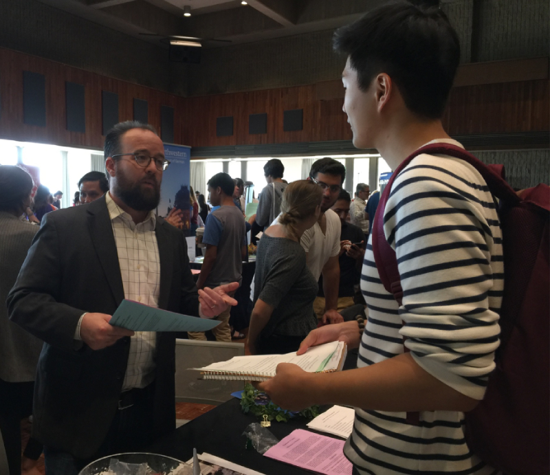 Professor Platte, Director of Undergraduate Studies, speaks to student at the Weinberg Academic Directions Fair