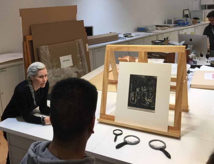 Students view pieces from the Classics themed collection at the Block Museum with Assistant Curator of Collections, Essi Rönkkö.